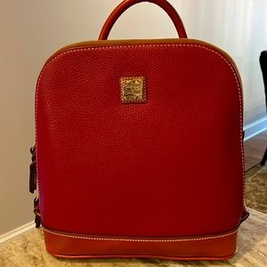 NWT- Dooney&Bourke Zip Pod Backpack. Pebbled red/burgundy leather with tan trim.